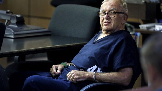 Juror Dennis DeMartin sits shackled in Palm Beach County Circuit Court, Jan. 28, 2014. He now lives in New England and has appealed his contempt of court charge. (Lannis Waters/The Palm Beach Post)