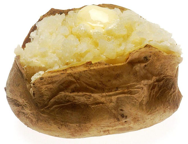 Baked potatoes become calorie-dense when loaded up with butter, cheese, sour cream and bacon.