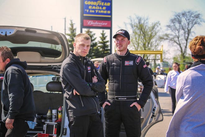 Brothers Corey (left) and Kyle Michalek, of Louisville, talk before a drag run in Norwalk.