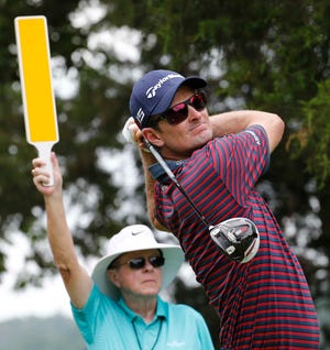 Justin Rose watches his tee shot on the second hole during the pro-am for the Quicken Loans National Golf tournament on Wednesday at the Robert Trent Jones Golf Club in Gainesville, Va. (AP Photo/Steve Helber)