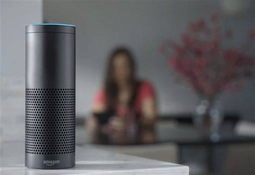 FILE - This file product image provided by Amazon shows the Amazon Echo, the latest advance in voice-recognition technology that's enabling machines to record snippets of conversation that are analyzed and stored by companies promising to make their customers' lives better. But the Internet-connected microphones and cameras on the devices are also raising the specter of them being used by corporations or hackers to snoop on private conversations. (Amazon via AP, File)