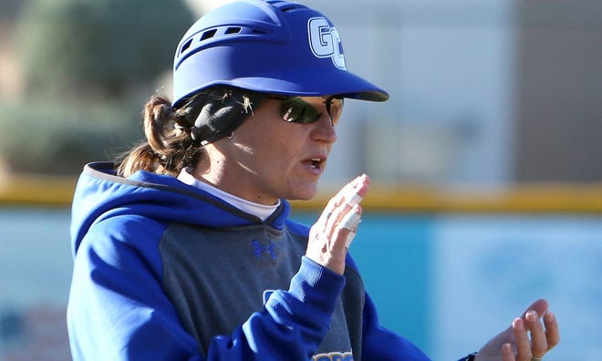 Gulf Coast head softball coach Beth Wade offers support from the third-base coaching box.