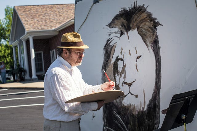 Artist Mark Balma paints a huge mural of Cecil in Dr. Walter Palmer's parking lot on July 29, 2015, at River Bluff Dental in Bloomington, Minn. Bala went to school in the Twin Cities and was visiting friends when he decided to come down for a "silent protest" against Dr. Walter Palmer and the killing of the lion in Zimbabwe. He also painted the frescoes at the University of St. Thomas Law School. He hopes to see the painting to raise money for wildlife preservation efforts. (Glen Stubbe/Minneapolis Star Tribune/TNS) 
 A sign posted on the door at River Bluff Dental on Tuesday, July 28, 2015 in Bloomington, Minn. River Bluff Dental owner Dr. Walter Palmer has gotten criticism over the sport killing of a beloved lion in Zimbabwe named "Cecil." (Renee Jones Schneider/Minneapolis Star Tribune/TNS) 
 Bernie the dog sniffs stuffed animals placed at the front door of River Bluff Dental on Tuesday, July 28, 2015 in Bloomington, Minn. River Bluff Dental owner Dr. Walter Palmer has gotten criticism over the sport killing of a beloved lion in Zimbabwe named "Cecil." (Renee Jones Schneider/Minneapolis Star Tribune/TNS)