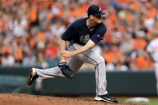Atlanta Braves starting pitcher Alex Wood follows through on a pitch to the Baltimore Orioles during an interleague baseball game, Monday, July 27, 2015, in Baltimore.