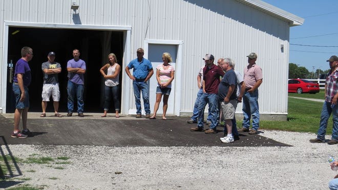 A group of Mercer County farmers listens to Brad Kruse of the National Education Center for Agricultural Safety discuss safe confined space entry procedures.
