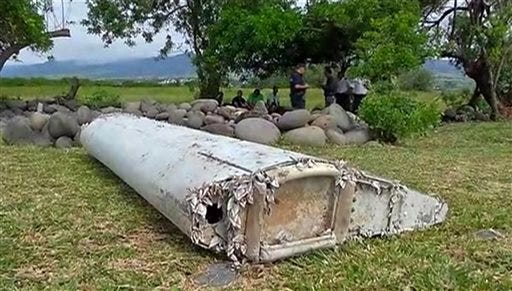 This image taken from video shows a piece of debris from a plane, Wednesday in Saint-Andre, Reunion. Air safety investigators, one of them a Boeing investigator, have identified the component as a "flaperon" from the trailing edge of a Boeing 777 wing, a U.S. official said. Flight 370, which disappeared March 8, 2014, with 239 people on board, is the only 777 known to be missing.