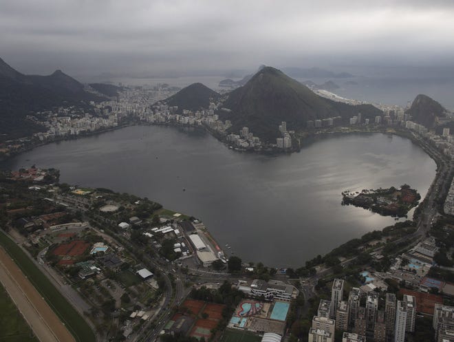 This aerial photo shows the Rodrigo de Freitas Lake in Rio de Janeiro, Brazil. An Associated Press analysis of water quality found dangerously high levels of viruses and bacteria from human sewage in Olympic and Paralympic venues. The Rodrigo de Freitas Lake, which was largely cleaned up in recent years, was thought be safe for rowers and canoers. Yet AP tests found its waters to be among the most polluted for Olympic sites. (AP Photo/Leo Correa