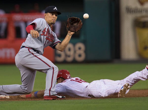 Philadelphia’s Cesar Hernandez is safe on a steal at second before Atlanta’s Jace Peterson can make the catch in the third inning Thursday in Philadelphia. (Laurence Kesterson | Associated Press)