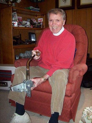 Ed Almquist of Milford, Pa., pictured in 2009, holds one of the floor shifters he designed and manufactured. He is the inventor of the Sparkomatic 6 electrode spark plug and designed the Hurst shifter. Almquist died on July 22. DONNA KESSLER/The Gazette