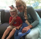 Kayla Burcker, dressed as Elsa from Disney’s ‘Frozen’ and a living room decorated with snowflakes greeted cancer victim Weston Rock when he returned home on July 24.
