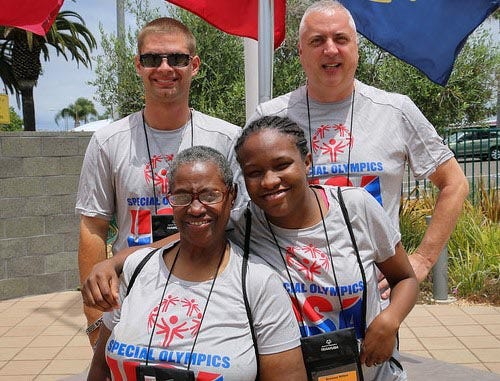 Breana Miles (front) is representing the Stark County Board of DD in the 2015 Special Olympics World Summer Games