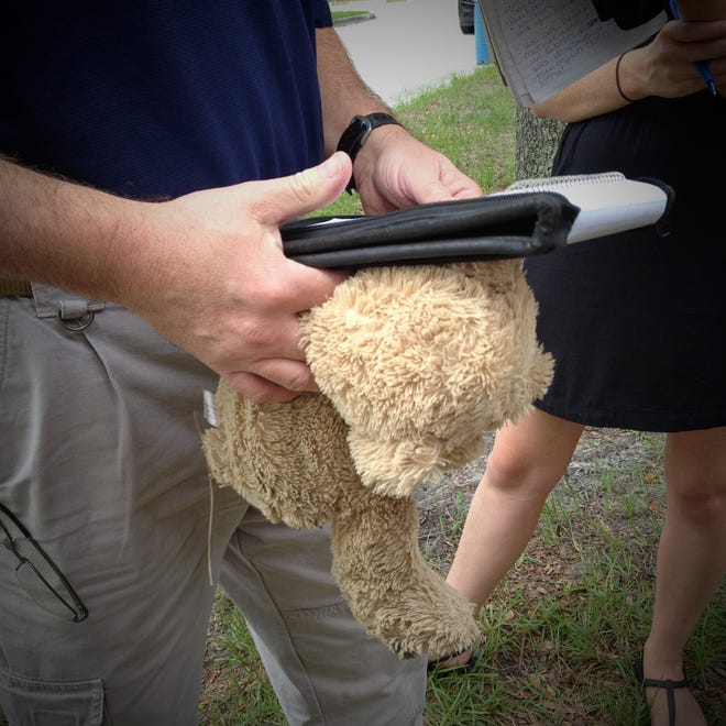 Before the noon press conference at Baker Skinner Park on Saturday JSO chief of investigations Tom Hackney picked up a teddy bear from the Lonzie Barton memorial. Hackney said the sticks and leaves stuck to the stuff animal made him think of Lonzie laying outside somewhere and then it made him think of the child never playing with his toys again.