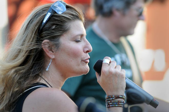Diane Schott of Yardley performs with the band Used Karma (Unplugged) during a Music on Main concert Saturday, August 1, 2015, in Yardley.