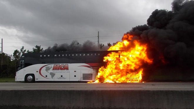 A tour bus full of teenagers caught fire on Florida's Turnpike, closing all northbound traffic, on Saturday afternoon near Stuart. All passengers left the bus safely. (Martin County Sheriff's Office)