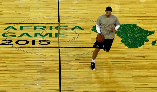 NBA player Nikola Vucevic of the Orlando Magic dribbles the ball during the practice for their NBA Africa Game at Ellis Park Arena in Johannesburg, South Africa, Friday, July 31, 2015. NBA players are in Johannesburg for the exhibition game Saturday featuring a Team World versus Team Africa.