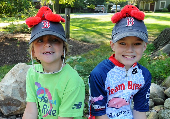 Residents of Wrentham's Cherry Street, along with their families, friends and visitors, cheered on riders participating in the Pan-Mass Challenge Saturday as the route brought them through west Wrentham. Wicked Local Staff Photo/ John Thornton