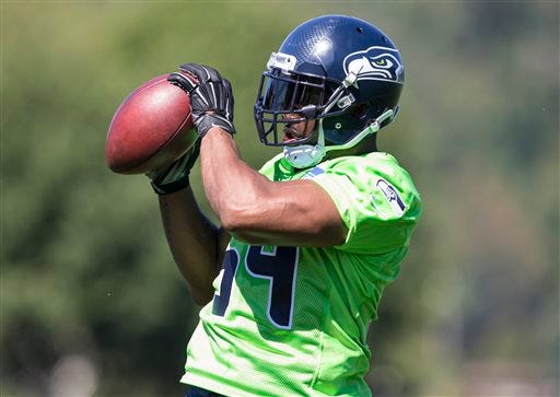 Seattle Seahawks linebacker Bobby Wagner catches a ball in drills during an NFL football training camp on Friday, July 31, 2015, in Renton, Wash. (AP Photo/Stephen Brashear)