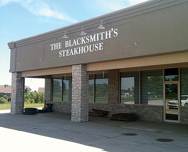 An outdoor eating, drinking and seating area at The Blacksmith's Steakhouse, a new Washington restaurant opening Aug. 14, will have a 40-inch wrought iron fence if the City Council passes liquor ordinance changes Monday. The former restaurant at the site had a 5-foot privacy fence.