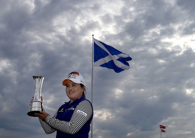 Inbee Park of South Korea poses with the trophy after winning the Women's British Open golf championship at the Turnberry golf course in Turnberry, Scotland, on Sunday, Aug. 2.