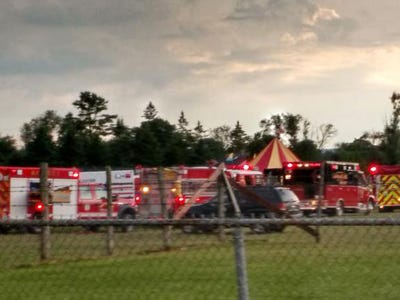 Officers surround the scene of a tent collapse in Lancaster, N.H., Monday, Aug. 3, 2015. Authorities say the circus tent collapsed when a severe storm raked the New Hampshire fairground.