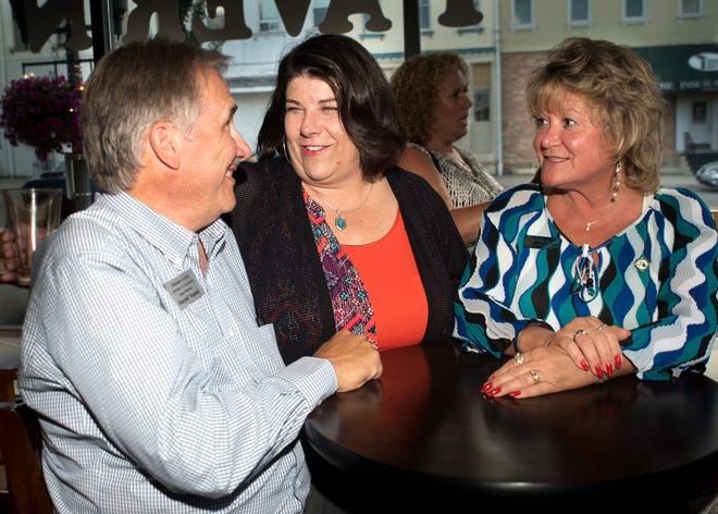 Randal Yagiela (left) and Susan Smith (right), executive director of the Hillsdale County Economic Development Partnership share a story and a laugh with Christine Bowman (center) Friday night at Broad Street Market. Bowman’s last day with the Chamber was Friday. Yagiela will be taking over as interim-director of the Chamber, until a replacement can be found. TODD LANCASTER PHOTO