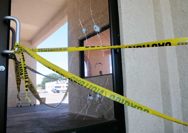 This Monday, Aug. 3, 2015 photo shows the damage left behind from shrapnel after a bomb was detonated at Holy Cross Catholic Church on Sunday morning in Las Cruces, New Mexico. There were no injuries and only minor damage. (Robin Zielinski/Las Cruces Sun-News via AP)