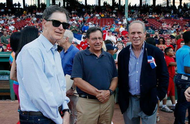 Boston Red Sox principal owner John Henry, from left, chairman Tom Werner and outgoing president and CEO Larry Lucchino before last Wednesday's game between the Red Sox and the Chicago White Sox in Boston.