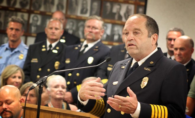 Retiring Salina Fire Chief Larry Mullikin speaks Monday at the Salina CIty Commission meeting.