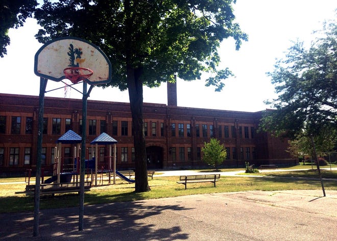 Holland Public Schools has a deal on the table to sell the former Washington School property, as seen Tuesday, Aug. 4, 2015, to a local development team to turn the building into apartments and potentially construct single-family homes on the property. Amy Biolchini/Sentinel Staff