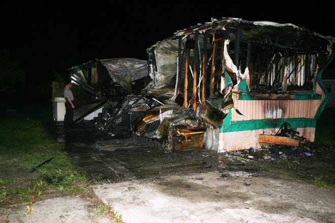 ONE PERSON DIED and another was rescued when this mobile home burned in Haines City.