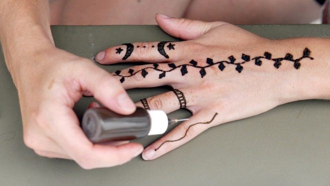 Get a hand-drawn henna design at this week’s Art After Dark. PALM BEACH POST FILE