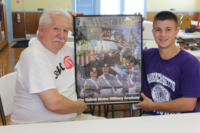 SPECTATOR PHOTOS BY GEORGE AUSTIN

Somerset American Legion Commander Steve Souza (left) gave Nick Casey (right) this poster from West Point. Casey hopes to attend West Point next year after graduating from Somerset Berkley Regional High School.
