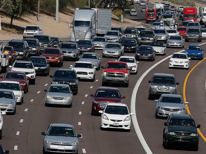 Afternoon rush our traffic moves along a highway in Phoenix. The average vehicle in the U.S. is now a record 11.5 years old, according to consulting firm IHS Automotive, a sign of the increased reliability of today’s vehicles and the lingering impact of the sharp drop in new car sales during the recession. (The Associated Press)