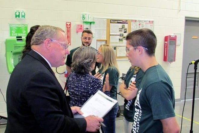 Howard D. Mettelman, left, Oneida-Herkimer-Madison BOCES district superintendent, speaks with Tory King, a New Hartford High School graduate, University of Notre Dame junior and intern at the Indium Corporation during an event Wednesday. GATEHOUSE NEW YORK PHOTO/S. ALEXANDER GEROULD
