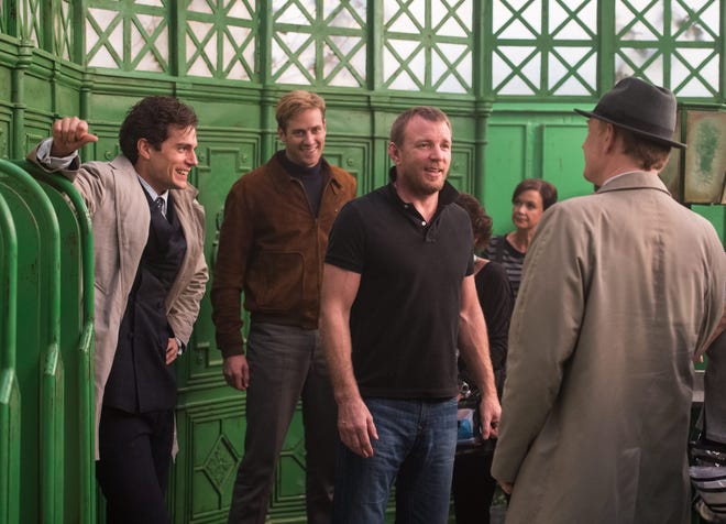 Guy Ritchie (black shirt) puts his cast through the paces on the set of “The Man from U.N.C.L.E.”