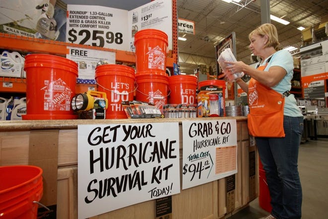 Linda Ellis sets up hurricane preparedness items at a Home Depot in Ocala in May 2014. With the peak of the hurricane season approaching, forecasters are saying it's going to be a below normal hurricane season. People in coastal areas should remain prepared because there are expected to be at least six to 10 tropical storms and one to four hurricanes.