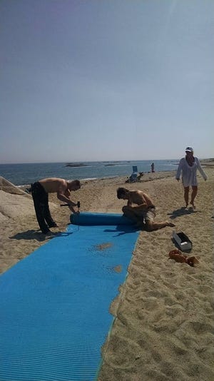 Westport Land Conservation Trust last month installed the final “access mat” in a set of four spread across the sand at the far end of Beach Avenue. SUBMITTED