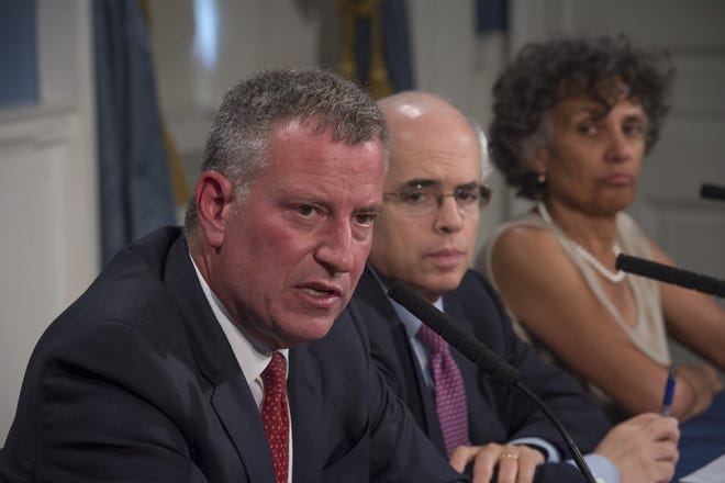 New York City Mayor Bill de Blasio, left, discusses the battle against an outbreak of Legionnaires' disease in New York. The New York Times