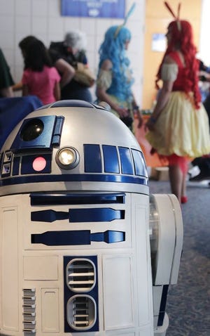 This life-sized, remote-controlled R2-D2 was strolling the aisles at CreativeCon.
