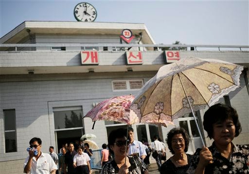 In this Sept. 1, 2014, photo, a clock is visible on top of a train station in Pyongyang, North Korea. North Korea said Friday, Aug. 7, 2015, that it will establish its own time zone next week by pulling back its current standard time by 30 minutes. The establishment of "Pyongyang time" is meant to root out the legacy of the Japanese colonial period, the North's official Korean Central News Agency said. (AP Photo/Wong Maye-E, File)