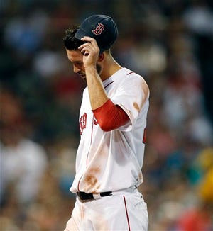 Red Sox pitcher Rick Porcello leaves the field after being taken out of a game last month in Boston. AP photo