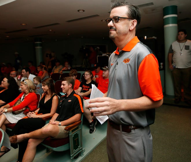 Larry Reece waits to take the stage to emcee a stop on the OSU Cowboy Caravan at Oklahoma State University - Tulsa in Tulsa, Okla., Thursday, Aug. 6, 2015. Reece, known as the "Voice of the Cowboys", is now cancer-free after being treated for throat cancer that was diagnosed earlier this year. Photo by Nate Billings, The Oklahoman