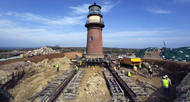 Workers move the Gay Head Light from its original footing in Aquinnah on Martha's Vineyard. A re-lighting ceremony is scheduled for Tuesday. File Photo/The Associated Press