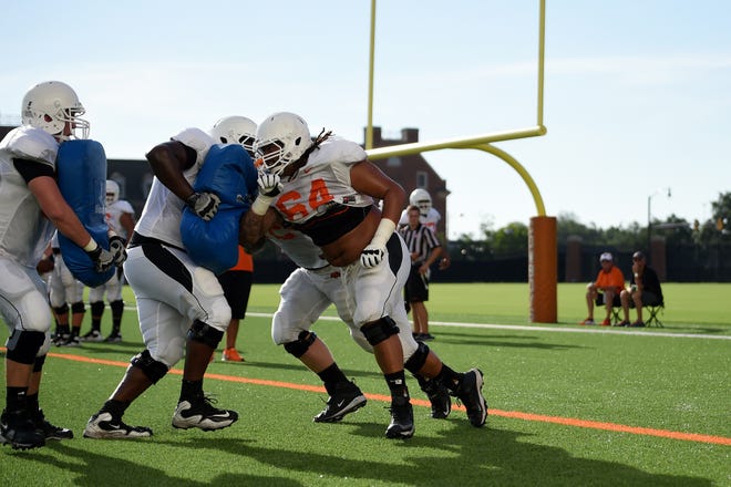 Jesse Robinson runs an offensive line drill during an Oklahoma State football practice at the Sherman E. Smith training center in Stillwater. TYLER DRABEK/for the Tulsa World
