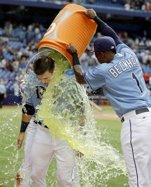 Tampa Bay's Tim Beckham douses Richie Shaffer with Gatorade after the Rays defeated the New York Mets 4-3 on Sunday afternoon to win the series. Shaffer hit a go-ahead home run in the seventh and the Rays held on to take two-of-three from the Mets.