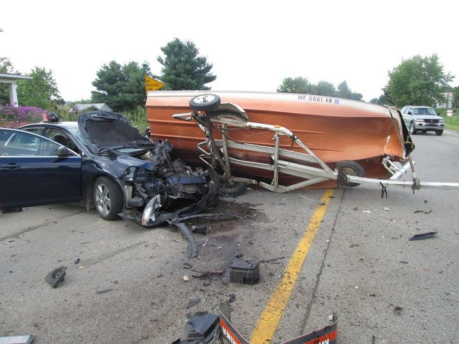 The car on the left rear-ended a pickup truck pulling this boat during an accident Sunday afternoon. The Ionia County Sheriff's Office said driver of the car caused the accident because they were driving while distracted. 

(Courtesy Photo)