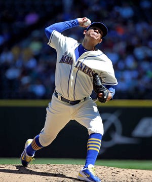 Seattle Mariners starting pitcher Felix Hernandez in action in a baseball game Sunday, Aug. 9, 2015, in Seattle. (AP Photo/Elaine Thompson)