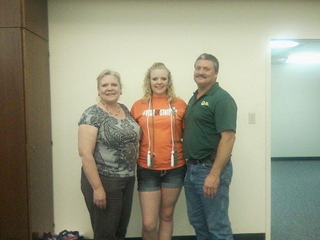Shaylee Arpin (center) poses with her parents, Karla and Gary.