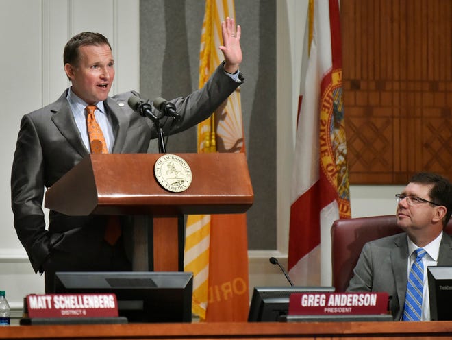 Mayor Lenny Curry (left) speaks as council president Greg Anderson listens during Curry's presentation of his budget to the city council Monday morning, July 20, 2015 in Jacksonville, Florida.