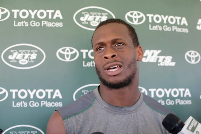 FILE - In this Aug. 4, 2015, file photo, New York Jets quarterback Geno Smith responds to questions during a news conference after practice at NFL football training camp in Florham Park, N.J. Jets quarterback Geno Smith will be sidelined at least 6-10 weeks after being punched in the jaw by teammate Ikemefuna Enemkpali. Coach Todd Bowles made the announcement before training camp practice Tuesday, Aug. 11, 2015.